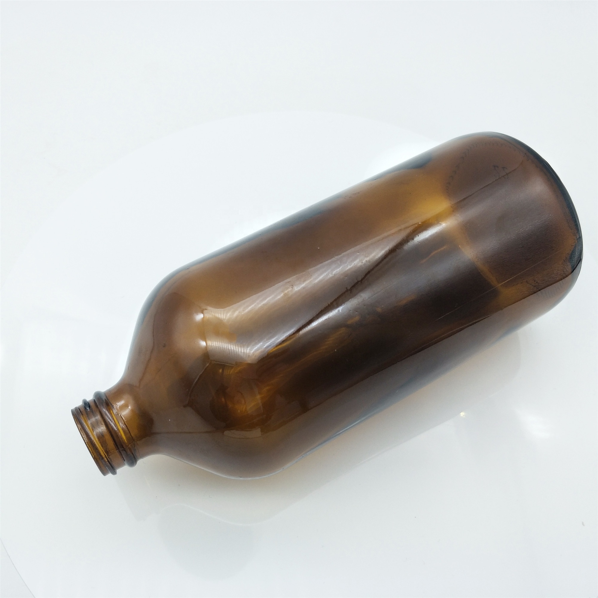 Wholesales 32oz Boston round amber glass bottle