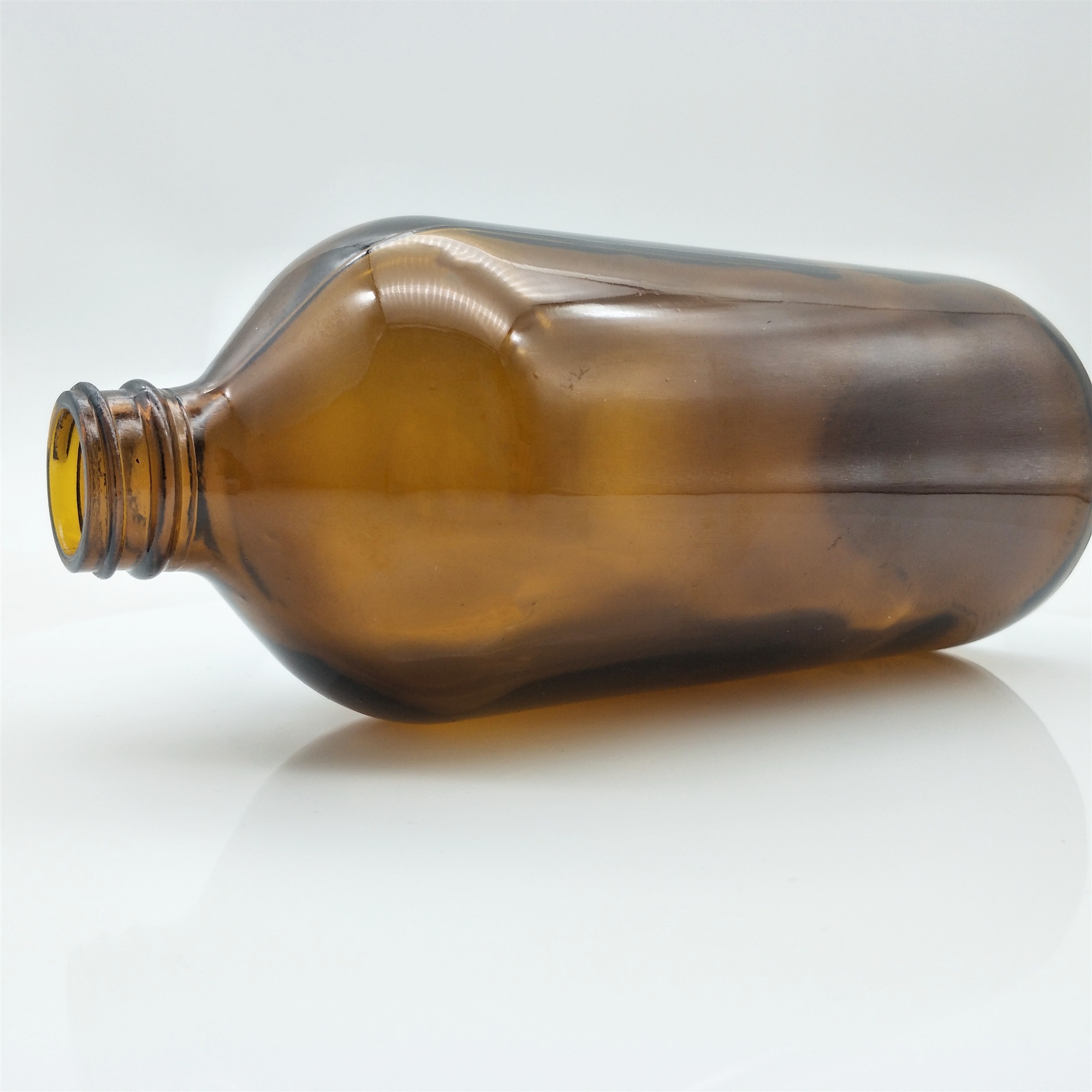 Wholesales 32oz Boston round amber glass bottle