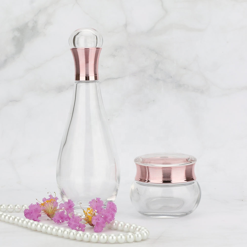 Wholesales high-grade Bowling shape clear cosmetics electroplating glass bottle and jars with good price rose golden lids