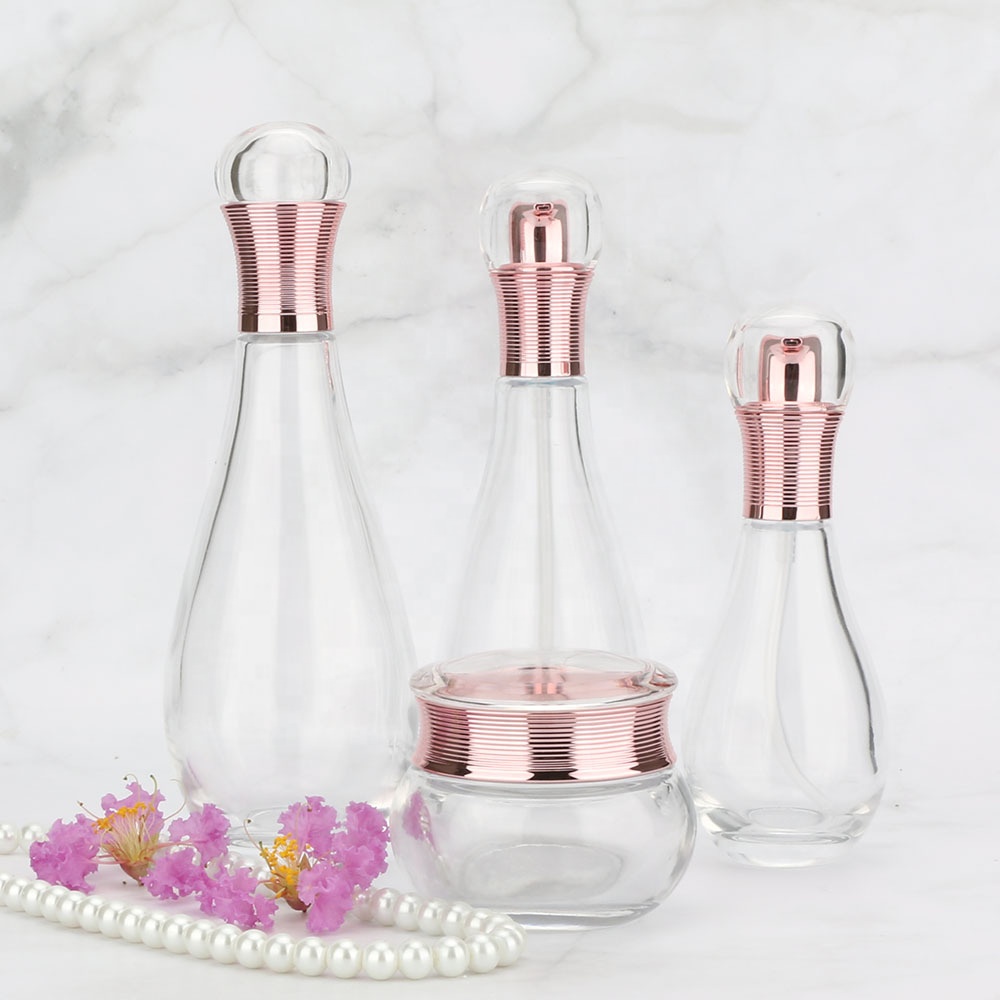 Wholesales high-grade Bowling shape clear cosmetics electroplating glass bottle and jars with good price rose golden lids