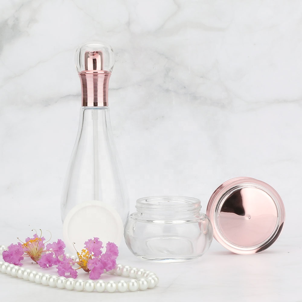 Wholesales high-grade Bowling shape clear cosmetics electroplating glass bottle and jars with good price rose golden lids