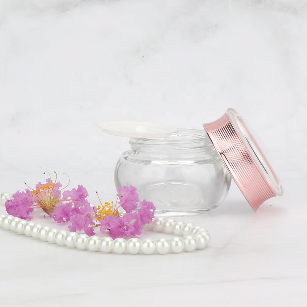 Wholesales high-grade Bowling shape clear cosmetics electroplating glass bottle and jars with good price rose golden lids