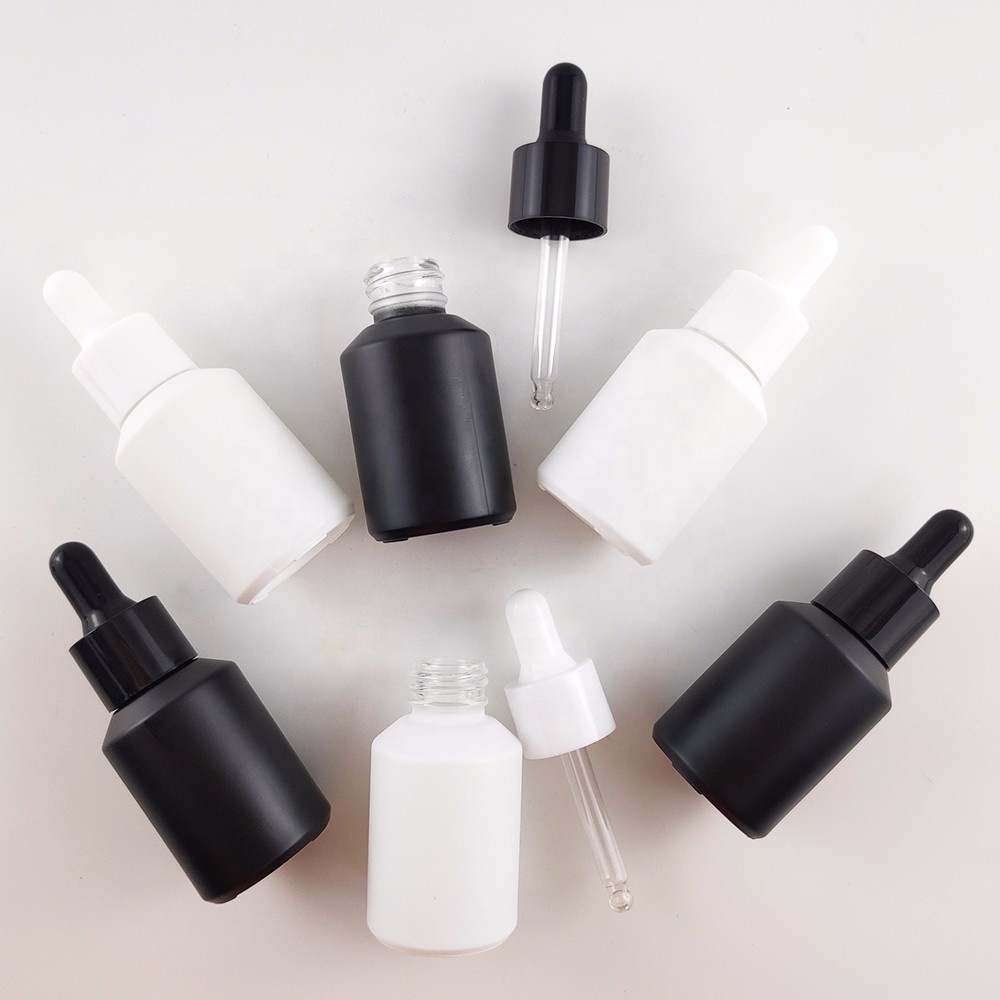 Whosale guangzhou 30ml frosted black white glass dropper bottle for oil packaging