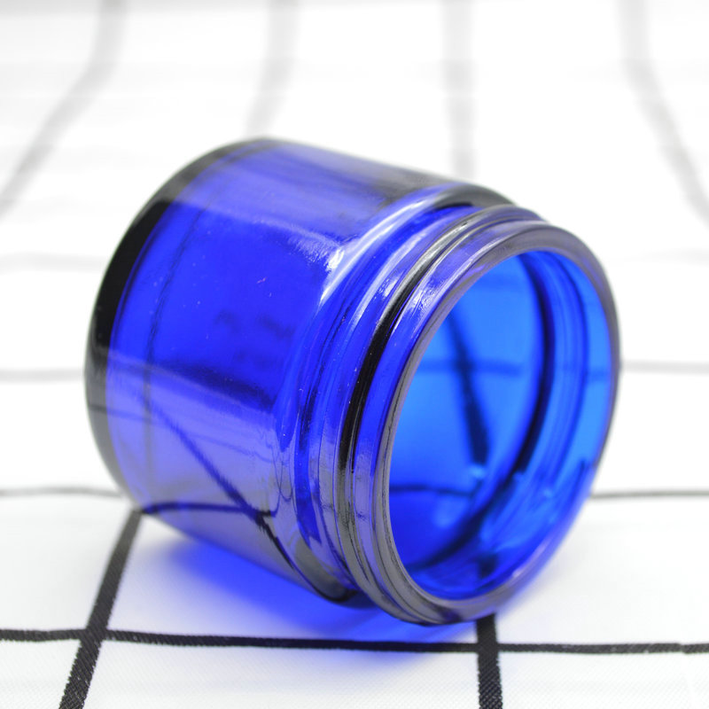 Xuzhou Abeisi free sample cosmetic face lotion container 60g 60ml cobalt blue face cream jar with black silver caps