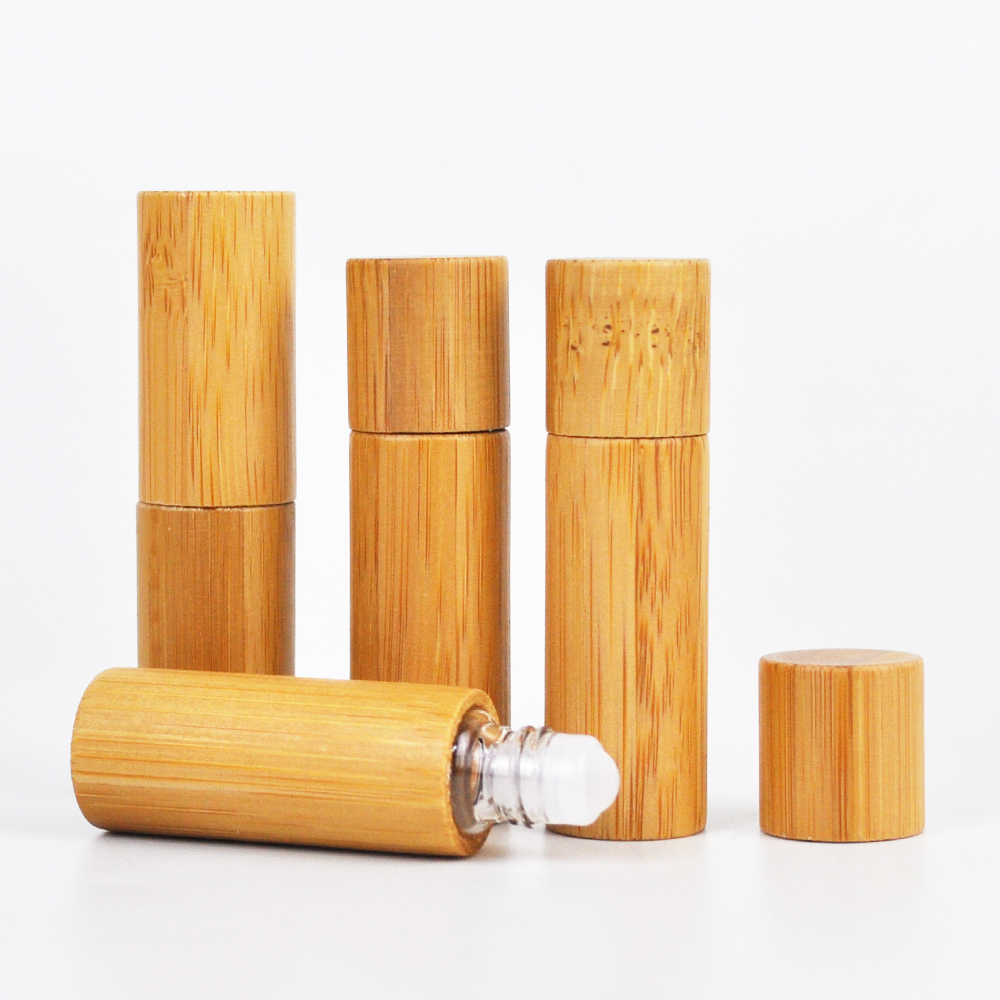 bamboo packaging custom roll on glass bottle with stainless steel ball woman face watch