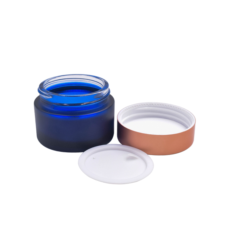 beautiful wholesale custom frosted dark blue cosmetic glass cream jar with rose golden lid