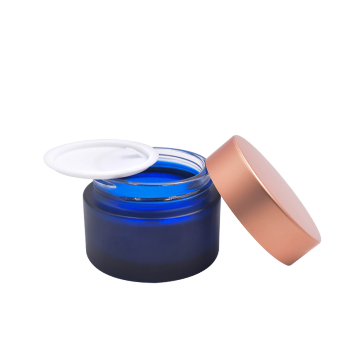beautiful wholesale custom frosted dark blue cosmetic glass cream jar with rose golden lid