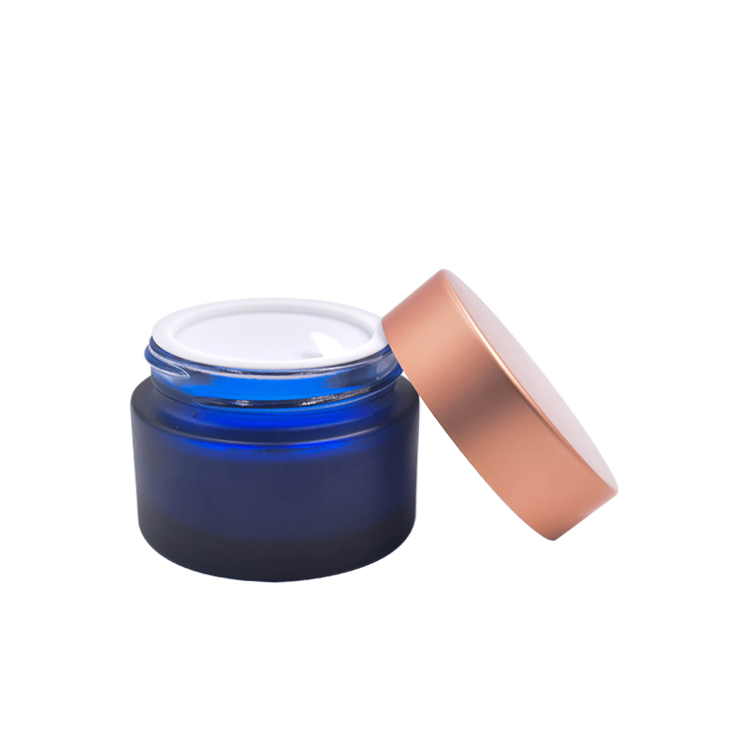 beautiful wholesale custom frosted dark blue cosmetic glass cream jar with rose golden lid