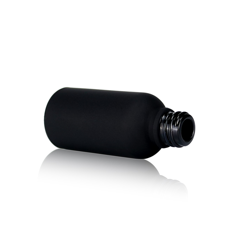 black dropper glass bottle with black cap for skincare packaging and cosmetic packaging