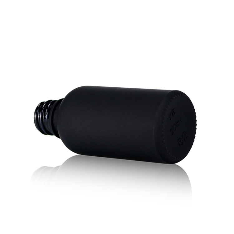 black dropper glass bottle with black cap for skincare packaging and cosmetic packaging
