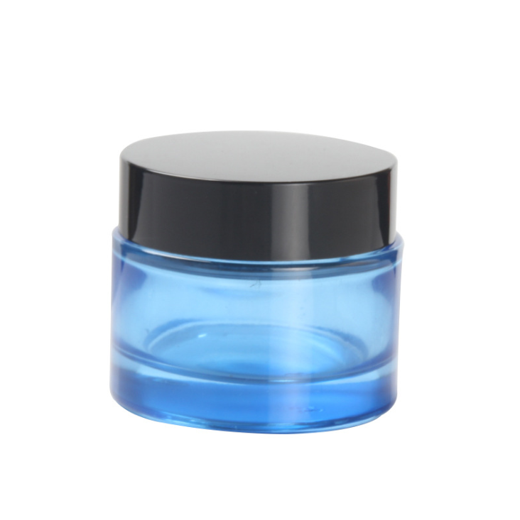 blue glass cosmetic facial cream jar with white black screw cap