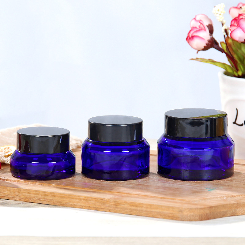 blue or amber color sloping shoulder cosmetic glass jar 15g 30g 50g with cap