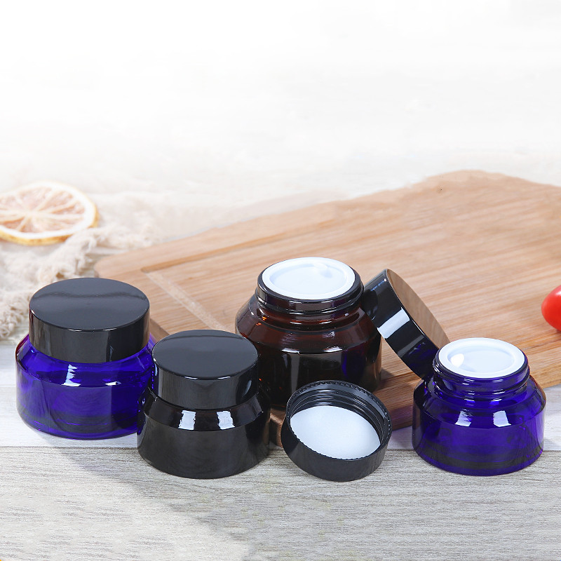 blue or amber color sloping shoulder cosmetic glass jar 15g 30g 50g with cap