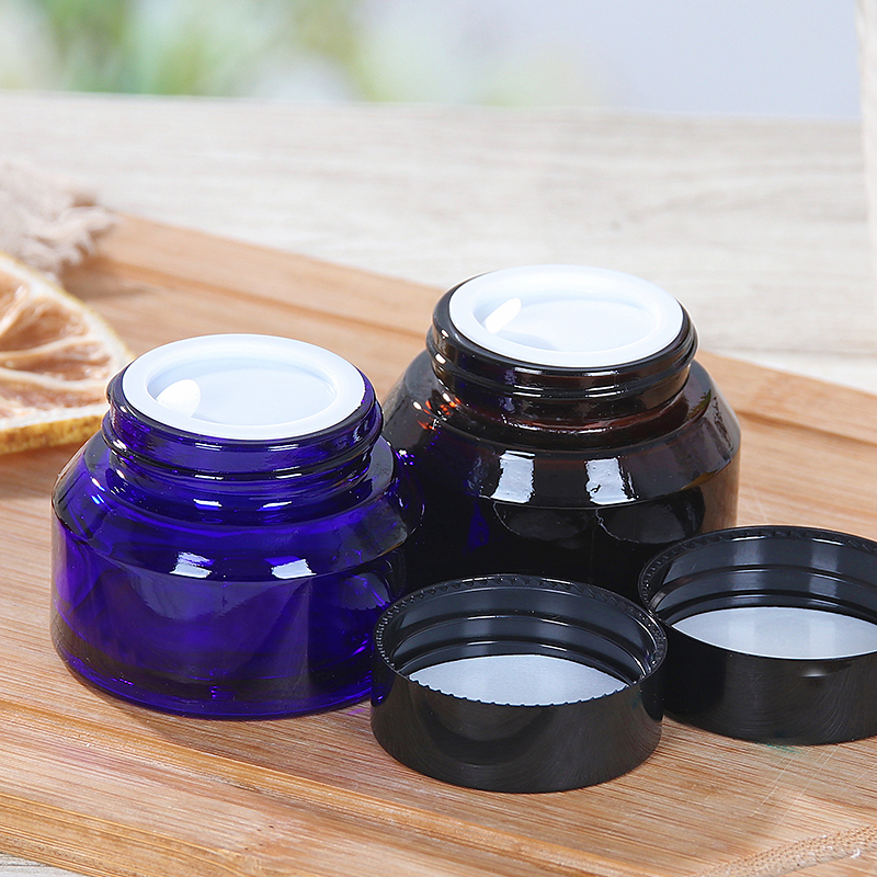 blue or amber color sloping shoulder cosmetic glass jar 15g 30g 50g with cap