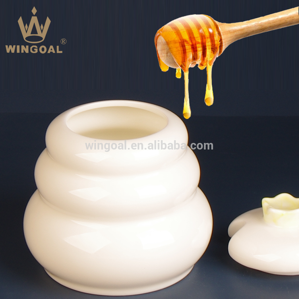 ceramic honey pot with wooden dipper