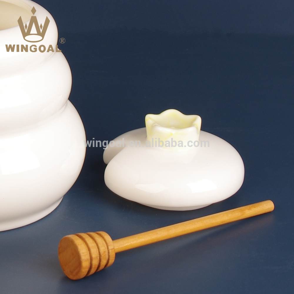 ceramic honey pot with wooden dipper