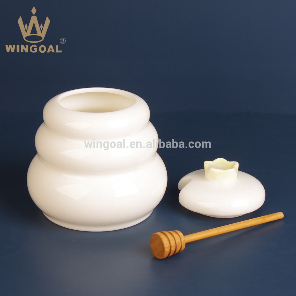 ceramic honey pot with wooden dipper