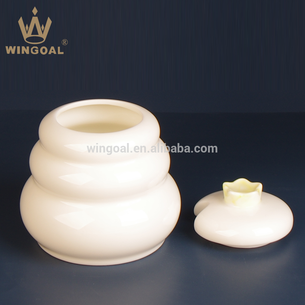 ceramic honey pot with wooden dipper