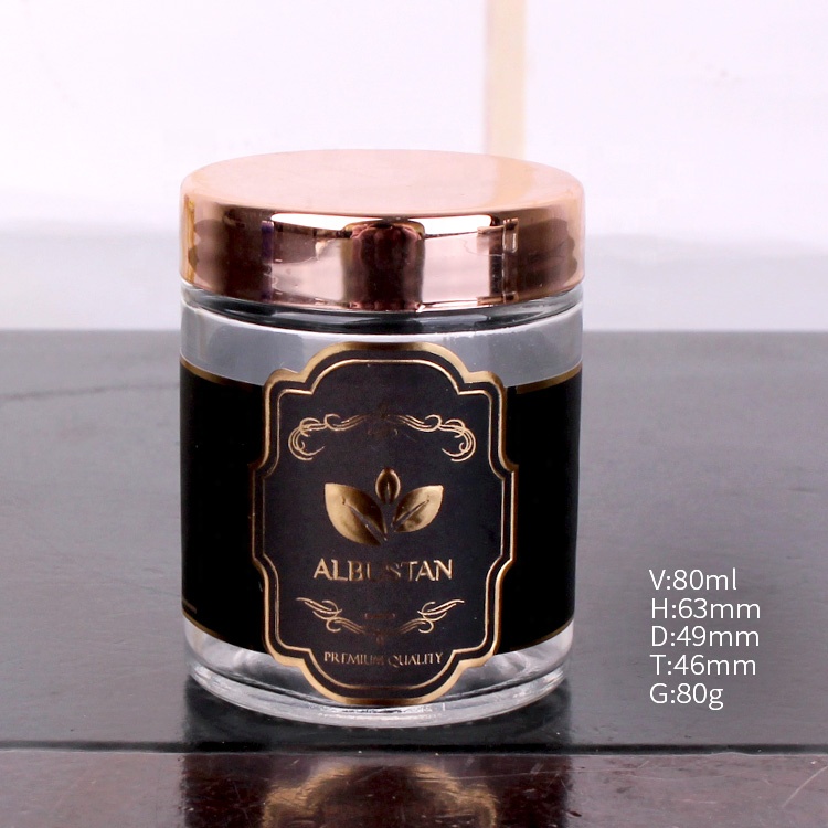 cheap cylinder 200ml glass jar with customized logo round glass jar with rose gold lid