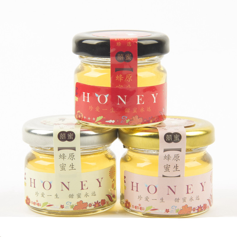 cheap mini 1oz round transparent glass jar for honey with metal lid