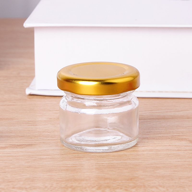cheap mini 1oz round transparent glass jar for honey with metal lid
