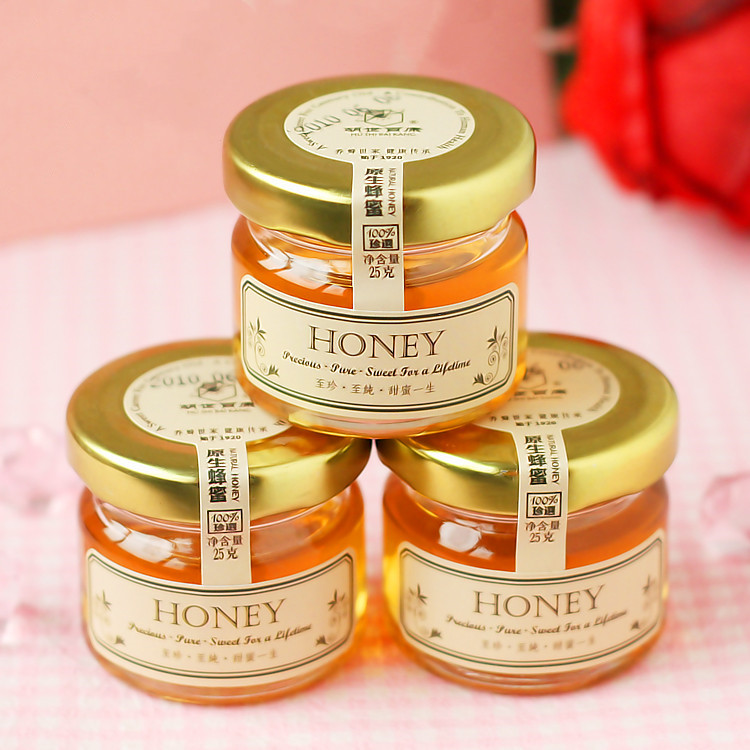 cheap mini 1oz round transparent glass jar for honey with metal lid