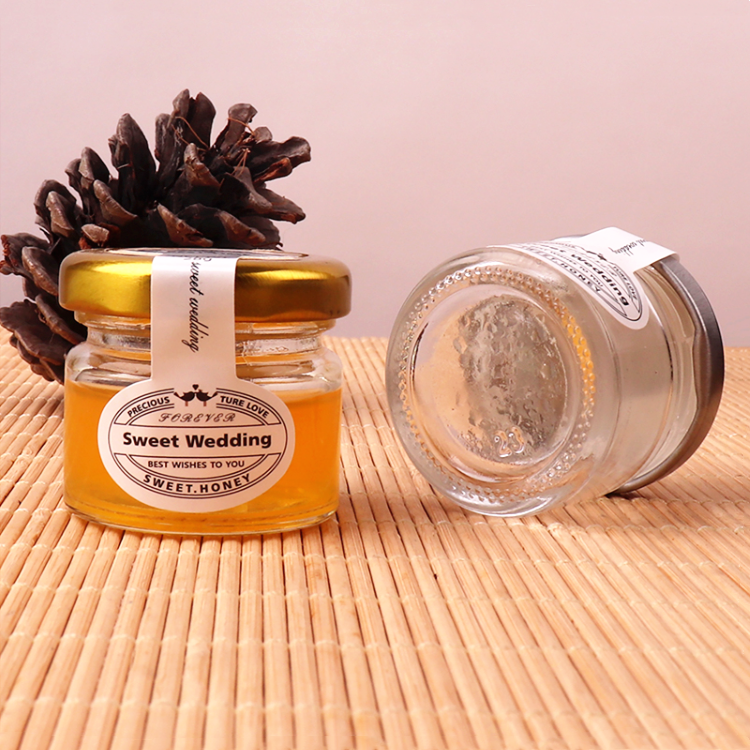 cheap mini 1oz round transparent glass jar for honey with metal lid