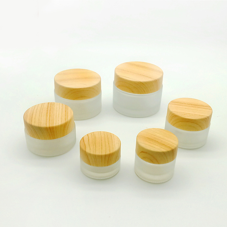 china factory high quality Frosted thickened Glass Cream Bottle Jar with wood grain cap and PP hand pad