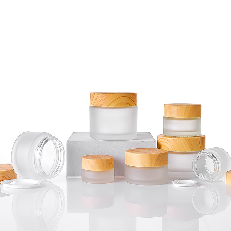 china factory high quality Frosted thickened Glass Cream Bottle Jar with wood grain cap and PP hand pad