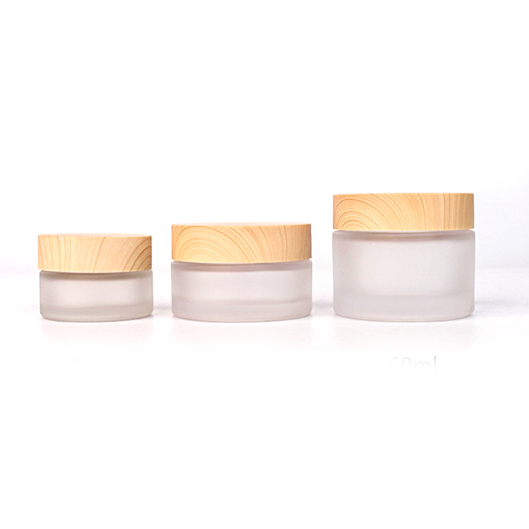 china factory high quality Frosted thickened Glass Cream Bottle Jar with wood grain cap and PP hand pad