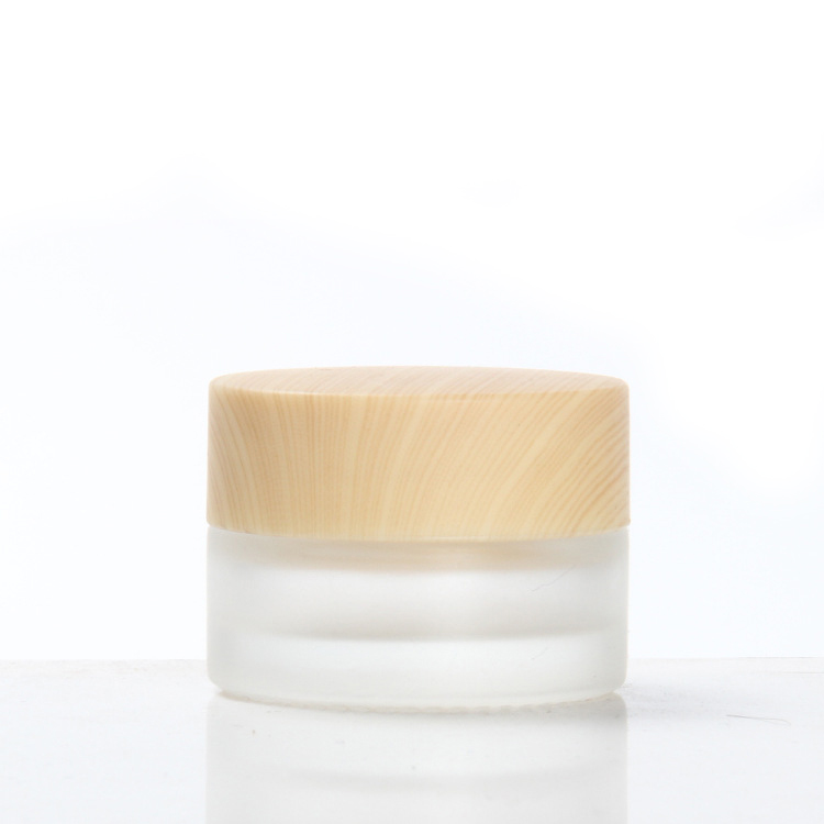 china factory high quality Frosted thickened Glass Cream Bottle Jar with wood grain cap and PP hand pad