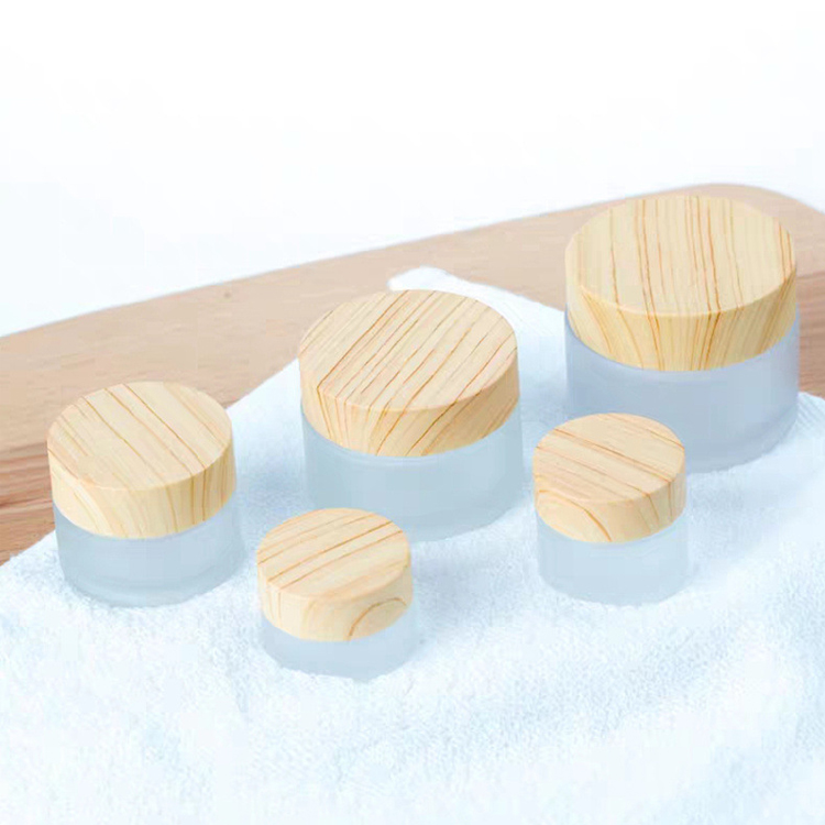 china factory high quality Frosted thickened Glass Cream Bottle Jar with wood grain cap and PP hand pad