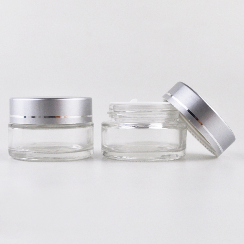 clear cream packaging 30g 1 oz round cosmetic glass jars with silver lid for eye cream