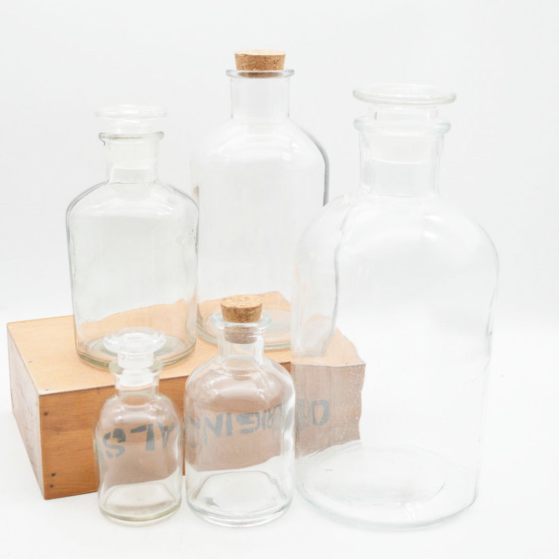 clear empty medical glass apothecary pharmaceutical pill bottle with narrow mouth