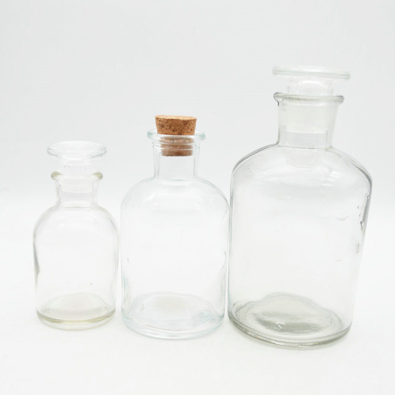 clear empty medical glass apothecary pharmaceutical pill bottle with narrow mouth