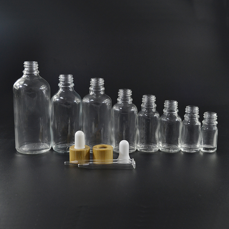 cosmetic packaging container 30ml 1oz 50ml 100ml bamboo cap glass dropper bottle for essential oil