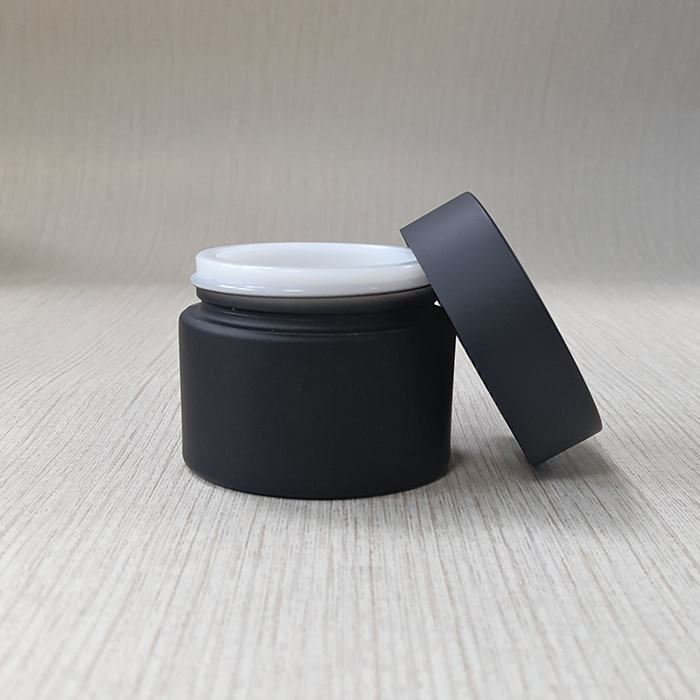 cream packing black frosted glass jar with matte black plastic cap