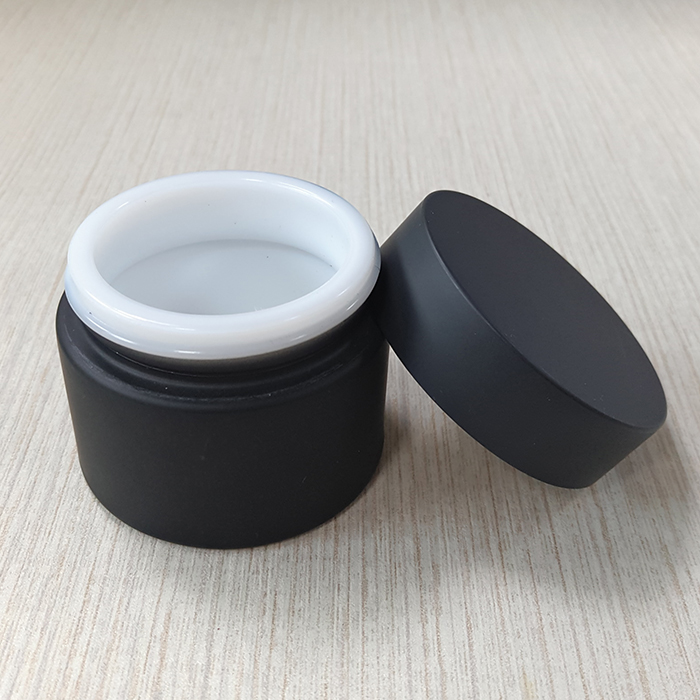 cream packing black frosted glass jar with matte black plastic cap