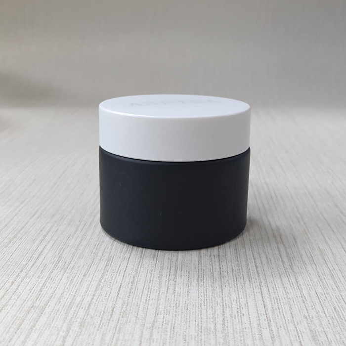 cream packing black frosted glass jar with matte black plastic cap