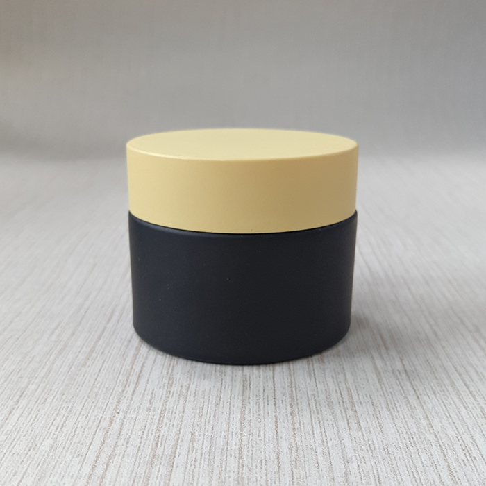 cream packing black frosted glass jar with matte black plastic cap