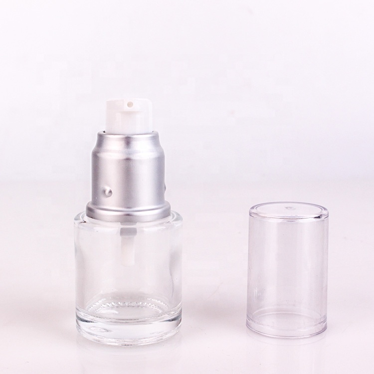 custom cosmetic packing 1oz clear glass lotion bottle with silver lotion pump