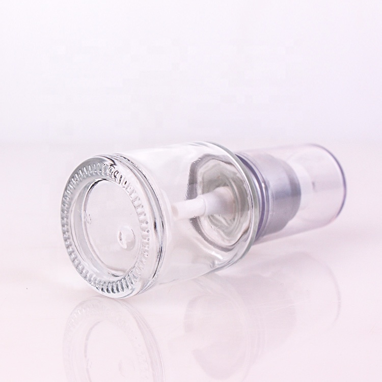 custom cosmetic packing 1oz clear glass lotion bottle with silver lotion pump