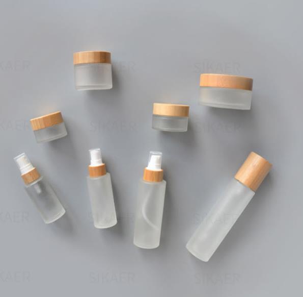 custom engraved logo 5ml 15ml 30ml 50ml 100g clear frosted glass jar with bamboo lid wood cap Cosmetic scrub jars body cream