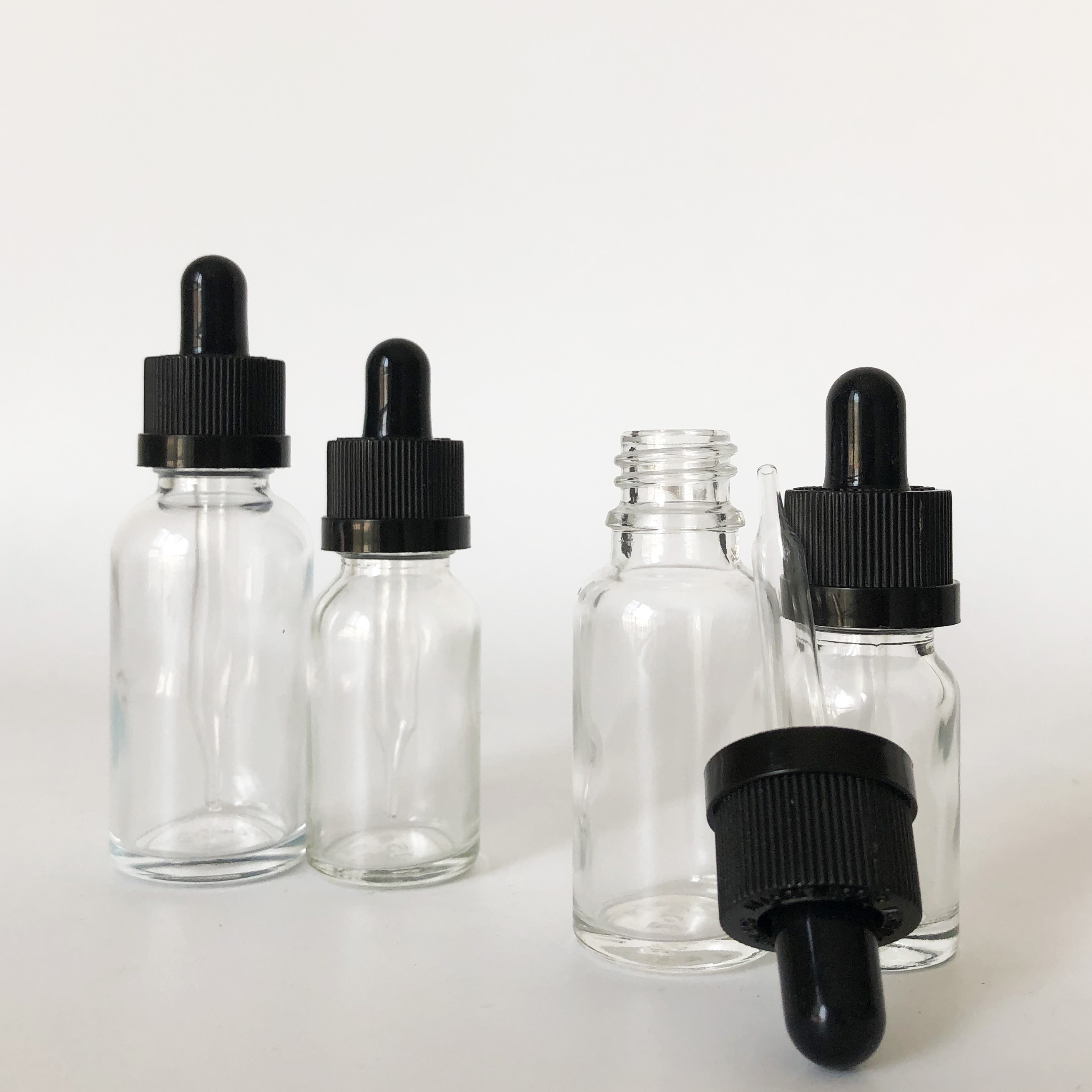 custom glass roller bottle 10ml 15ml 20ml 30ml clear glass dropper bottle for essential oil with childproof cap