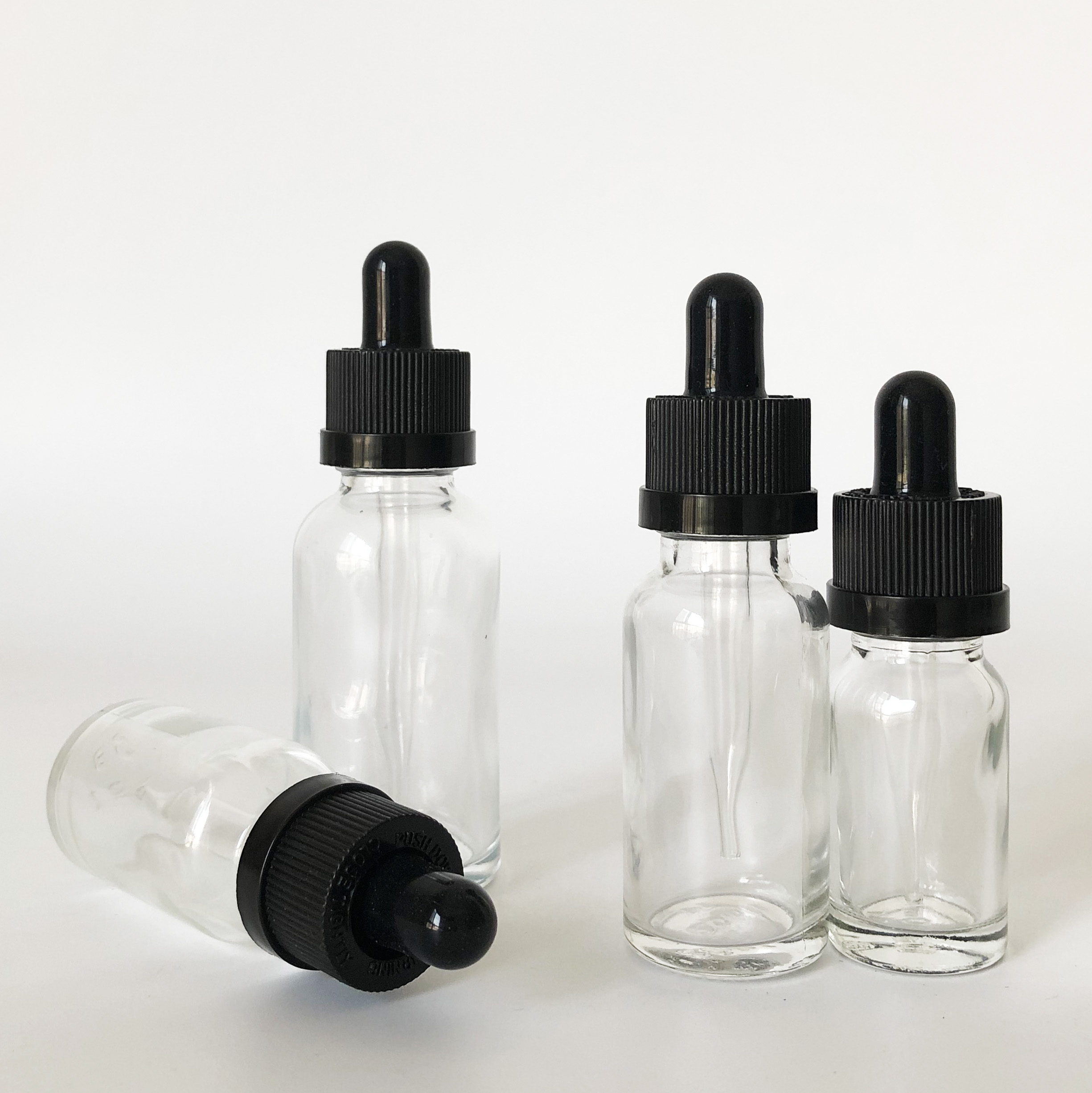 custom glass roller bottle 10ml 15ml 20ml 30ml clear glass dropper bottle for essential oil with childproof cap
