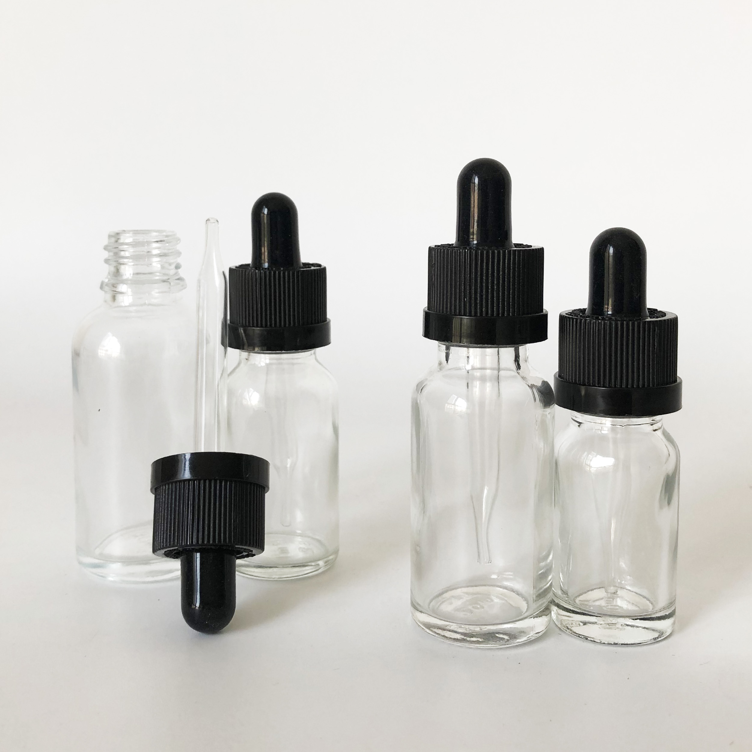 custom glass roller bottle 10ml 15ml 20ml 30ml clear glass dropper bottle for essential oil with childproof cap