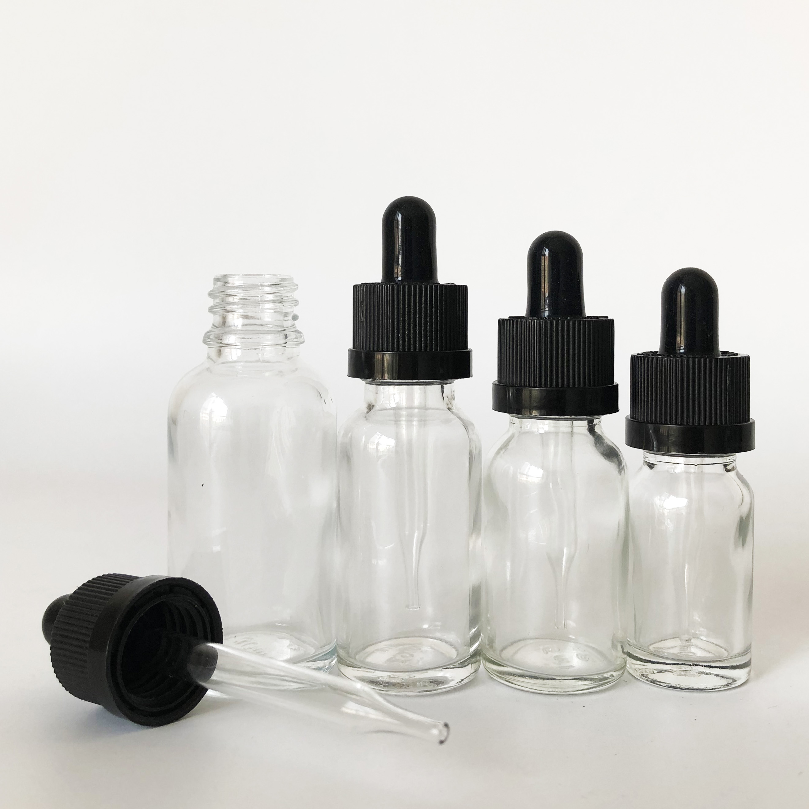 custom glass roller bottle 10ml 15ml 20ml 30ml clear glass dropper bottle for essential oil with childproof cap