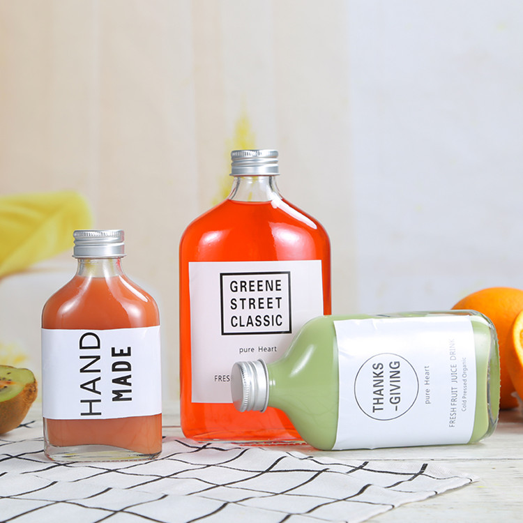 customized 50ml 100ml 200ml 250ml 350ml 500ml flat glass beverage bottle for cold brew with screw cap