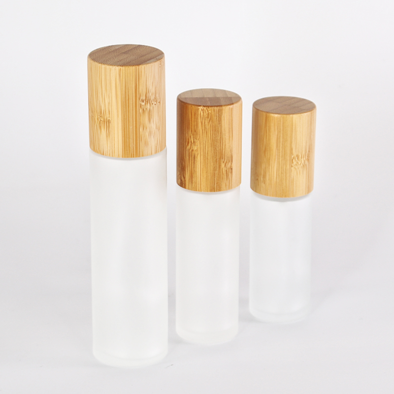 customized glass lotion bottle with sprayer pump bamboo collar
