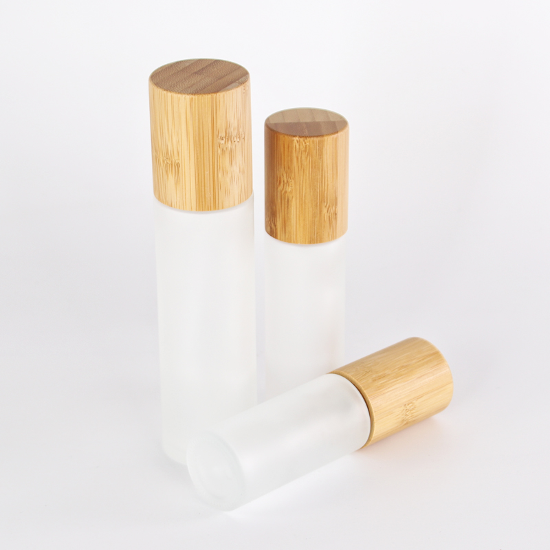 customized glass lotion bottle with sprayer pump bamboo collar